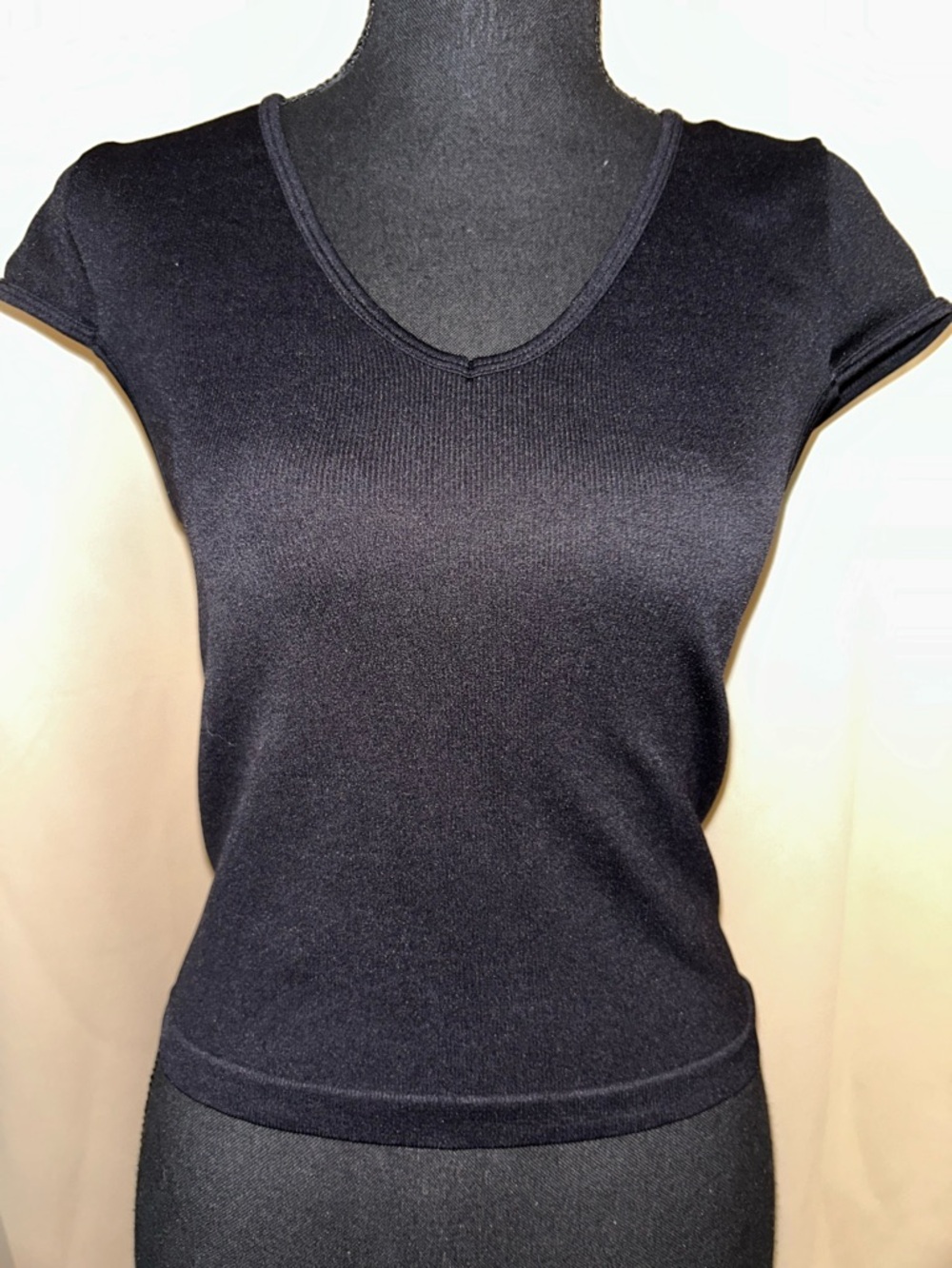 Cotton Candy V-neck fitted black top 8% stretch. Ladies Size M/L